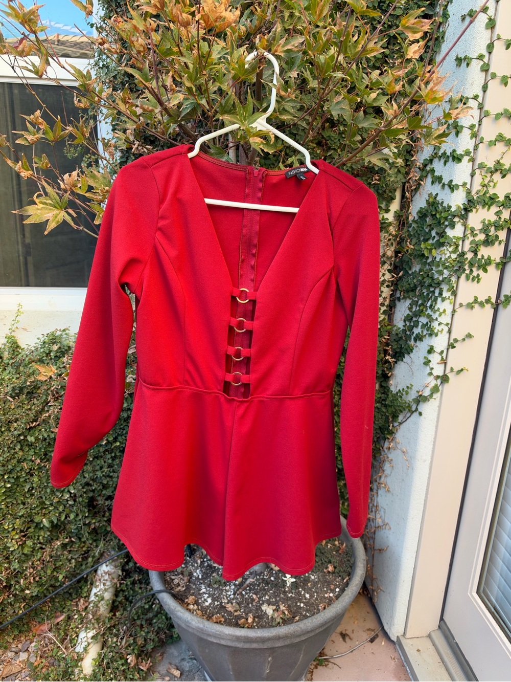 Fashion Nova Redish Orange Long-Sleeve V-Neck Peplum romper with Front Rings